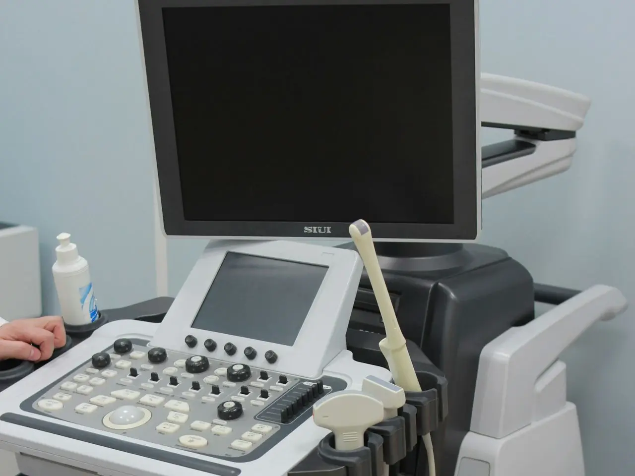 a medical machine with a monitor on top of it